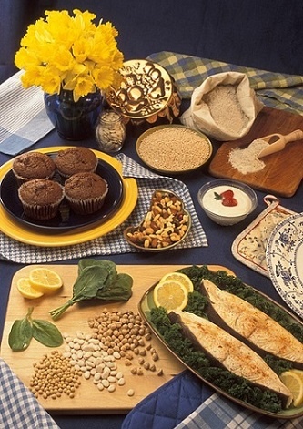 Nutrition for Runners - A display of magnesium-rich foods, including leafy greens, chickpeas, fish, nuts, quinoa, whole grains, and dark chocolate muffins, promoting muscle recovery and energy replenishment for runners.