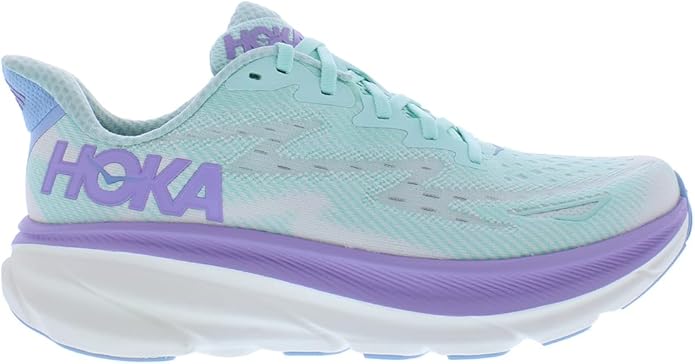 Side view of the HOKA Clifton 9 Women’s Running Shoes in light blue with a white sole and purple accents, featuring the HOKA logo in purple on the side, a breathable mesh upper, and a cushioned sole for enhanced running comfort and support.