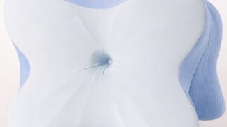 Derila Ergo pillow with contoured memory foam shape and blue side mesh on a clean light background.